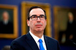 In this April 11, 2018, file photo, Treasury Secretary Steve Mnuchin smiles as he testifies on the FY2019 budget during a hearing of the House Appropriations Committee Subcommittee on State, Foreign Operations, and Related Programs, on Capitol Hill in Washington. Mnuchin plans to lead a delegation of American officials to Beijing next week.