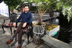 In this March 23, 2018, photo, Shane Pliska, owner of Planterra, a commercial florist and owner of a wedding venue where the decor is all about flowers and plants poses for a photo at his company, in West Bloomfield, Mich. When Hurricane Irma forced Miami International Airport to shut down in September, flower shipments from South America, couldn’t arrive. But the floral industry is set up for such contingencies, and distributors quickly arranged for shipments from other parts of the world. Pliska got flowers from Kenya in that case.