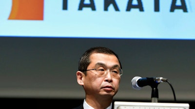 In this Nov. 4, 2015 file photo, Shigehisa Takada, president and CEO of Japanese parts supplier Takata Corp., attends a press conference in Tokyo. Takata Corp., the Japanese air bag maker embroiled in a massive recall, says the acquisition by U.S. mobility safety company Key Safety Systems has been completed, and the president resigned. Takata President Takada said Thursday, April 12, 2018, in a statement he has resigned as president and chairman, replaced by Yoichiro Nomura, chief financial officer, effective Wednesday.