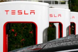 In this May 14, 2015, file photo, Tesla charging stations are shown outside of the Tesla factory in Fremont, Calif. California workplace safety regulators say they are investigating two incidents at automaker Tesla’s factory. The investigations follow a report by the Center for Investigative Reporting cataloguing a series of workplace injuries at Tesla. Tesla said the center incorrectly counted injuries that occurred away from the factory in Fremont.