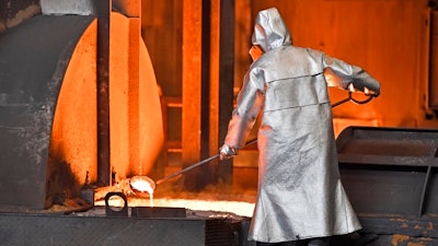 A worker controls iron at the Thyssenkrupp steel factory in Duisburg, Germany, Friday, April 27, 2018. Duisburg is the biggest steel producer site in Europe.