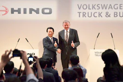 Andreas Renschler, right, a board member at Volkswagen AG and CEO of Volkswagen Truck & Bus, and Hino Motors President and Chief Executive Yoshio Shimo, left, pose for the media during a press conference in Tokyo, Thursday, April 12, 2018. Hino Motors, Toyota Motor Corp.'s group truck manufacturer, and Volkswagen Truck & Bus of Germany agreed Thursday to work together in a partnership on technologies like hybrids, electric cars, autonomous driving and connectivity.
