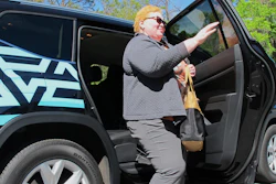 In this photo taken March 7, 2018 shows Cinzhasha Farmer, who is blind, exiting a vehicle equipped with software meant to help the visually impaired interact with self-driving cars in Ocala, Fla. The 41-year-old was eager to participate in the study so she can one day drive without relying on others.'It's one of my goals and I don't know how I'll ever accomplish it, but that car may do it,' she said with a smile.