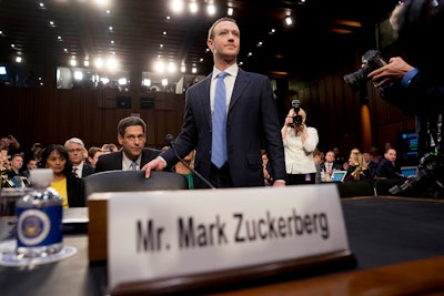 Facebook CEO Mark Zuckerberg arrives to testify before a joint hearing of the Commerce and Judiciary Committees on Capitol Hill in Washington, Tuesday, April 10, 2018, about the use of Facebook data to target American voters in the 2016 election.