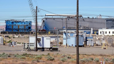 This May 13, 2017, photo shows a portion of the Plutonium Finishing Plant on the Hanford Nuclear Reservation near Richland, Wash. Officials say dozens of workers demolishing the 1940s-era plutonium processing plant there have ingested or inhaled radioactive particles in the past year, prompting a halt to the demolition of the plant until a safe plan can be developed.