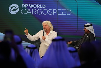 Richard Branson talks next to Sultan Ahmed bin Sulayem during the Hyperloop One presentation aboard the Queen Elizabeth 2 in Dubai, United Arab Emirates, Sunday, April 29, 2018. DP World's chairman and CEO Sultan Ahmed bin Sulayem said Sunday that Virgin Hyperloop One would launch a freight service called DP World Cargospeed.