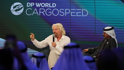 Richard Branson talks next to Sultan Ahmed bin Sulayem during the Hyperloop One presentation aboard the Queen Elizabeth 2 in Dubai, United Arab Emirates, Sunday, April 29, 2018. DP World's chairman and CEO Sultan Ahmed bin Sulayem said Sunday that Virgin Hyperloop One would launch a freight service called DP World Cargospeed.