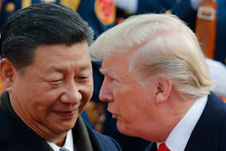 In this Nov. 9, 2017, photo, U.S. President Donald Trump, right, talks to Chinese President Xi Jinping during a welcome ceremony at the Great Hall of the People in Beijing. The brewing China-U.S. trade conflict features two leaders who’ve expressed friendship but are equally determined to pursue their nation's interests and their own political agendas. But while Trump faces continuing churn in his administration and a tough challenge in midterm congressional elections, Xi leads an outwardly stable authoritarian regime. Xi recently succeeded in pushing through a constitutional reform allowing him to rule for as long as he wishes while facing no serious electoral challenge.