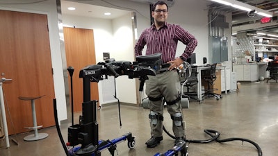 Professor Sharma wearing a lower-limb exoskeleton in his neuromuscular control and robotics laboratory.