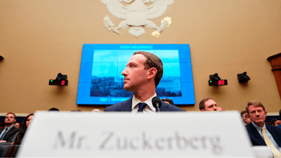 Facebook CEO Mark Zuckerberg testifies before a House Energy and Commerce hearing on Capitol Hill in Washington, Wednesday, April 11, 2018, about the use of Facebook data to target American voters in the 2016 election and data privacy.