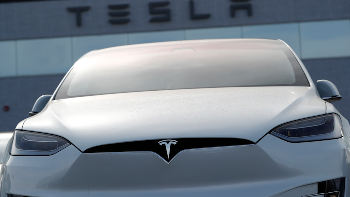 In this April 15, 2018, file photo, an unsold 2018 Model X 100d sits on a Tesla dealer's lot in the south Denver suburb of Littleton, Colo.
