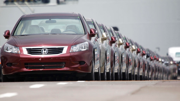 In this March 29, 2010 file photo, Japanese automaker Honda Motor Co.'s vehicles for export park at a Yokohama port, near Tokyo, Japan. China and Japan both condemned Thursday, May 24, 2018 the Trump administration's decision to launch an investigation into whether tariffs are needed on imports of vehicles and automotive parts into the United States.