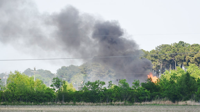 Smoke rises from a chemical fire Thursday, May 3, 2018, at a business near I-10 in Duson, La. Louisiana State Police say no injuries have been reported from the fire at FlowChem Technologies in Rayne. There was no immediate report of what caused the fire at the specialty chemical complex, which provides products and services to the oil and gas industry.