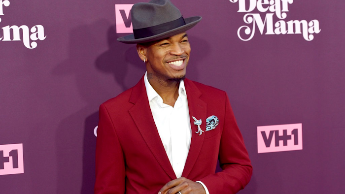 In this May 3, 2018, file photo, Ne-Yo arrives at the 3rd annual 'Dear Mama: A Love Letter to Moms' at The Theatre at Ace Hotel in Los Angeles. Kevin Foster, of Montclair, N.J., is accused of running a multimillion dollar scam that bilked singers Ne-Yo and Brian McKnight who invested in a sports drink company.