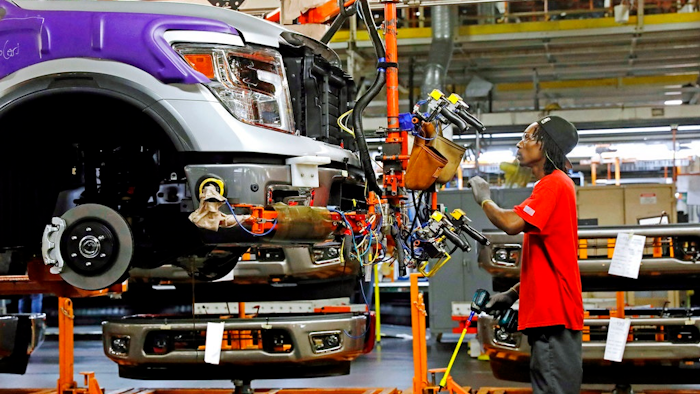 In this March 19, 2018, file photo, a line technician positions a truck front bumper for assembly at the Nissan Canton Assembly Plant, in Canton, Miss. On Wednesday, April 16, the Federal Reserve reports on U.S. industrial production for April.