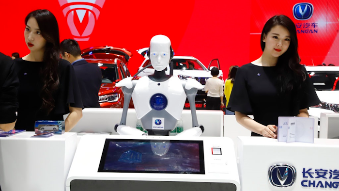 In this April 26, 2018, file photo, a robot assist receptionist is seen at the booth of a Chinese automaker during the China Auto 2018 show in Beijing, China. Under President Xi Jinping, a program known as 'Made in China 2025' aims to make China a tech superpower by advancing development of industries that in addition to semiconductors includes artificial intelligence, pharmaceuticals and electric vehicles.