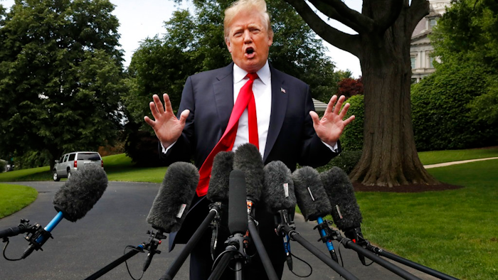 President Donald Trump's hair is ruffled by a breeze as he speaks to the media on the South Lawn of the White House in Washington, Wednesday, May 23, 2018, en route to a day trip to New York. Trump will hold a roundtable discussion on Long Island on illegal immigration and gang violence that the White House is calling a 'national call to action for legislative policy changes.'