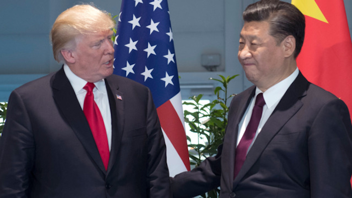 In this Saturday, July 8, 2017, file photo, U.S. President Donald Trump, left, and Chinese President Xi Jinping arrive for a meeting on the sidelines of the G-20 Summit in Hamburg, Germany.
