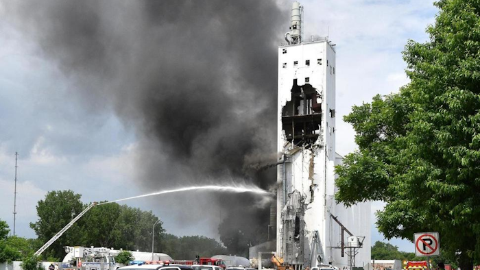 Emergency workers respond to the scene of a grain elevator explosion and fire near the intersection 4th Avenue and West 24th Street in South Sioux City, Neb., Tuesday, May 29, 2018.