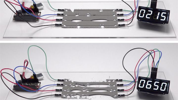 A digital clock continues to run as damaged circuits instantaneously heal themselves, rerouting electrical signals without interruption.