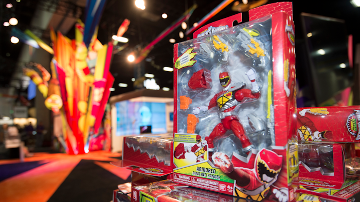 In this July 8, 2015, file photo, a Power Rangers figure sits on display at a booth before Preview Night at Comic-Con International held at the San Diego Convention Center in San Diego. Hasbro is buying the Power Rangers and some other toy brands from Saban Properties in a cash-and-stock deal valued at about $522 million.
