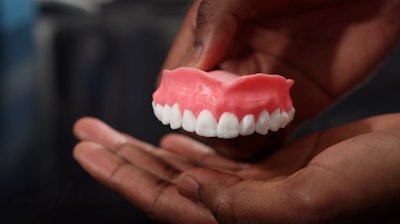 The dentures are printed using acrylamide, the current go-to material for denture fabrication.