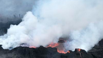 In this Saturday, May 26, 2018, image released by the U.S. Geological Survey HVO shows an aerial view of fissure 22 looking toward the south, as Kilauea Volcano continues its eruption cycle near Pahoa on the island of Kilauea, Hawaii. Lava from the Kilauea volcano has reached a geothermal power plant on the Big Island, approaching wells that have been capped to protect against the release of toxic gas should they mix with lava.