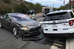 This photo provided by the Laguna Beach Police Department shows a Tesla sedan, left, in autopilot mode that crashed into a parked police cruiser Tuesday, May 29, 2018, in Laguna Beach, Calif. Police Sgt. Jim Cota says the officer was not in the cruiser at the time of the crash and that the Tesla driver suffered minor injuries.
