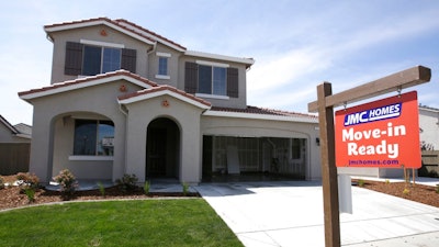 A for sale sign hangs outside a recently built house Friday, May 4, 2018, near Roseville, Calif. Federal data released Friday shows California has surpassed the United Kingdom to become the world fifth largest economy, with real estate and financial services leading other economic sectors in driving the state's economic growth.