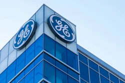 In this Jan. 16, 2018, file photo, the General Electric logo is displayed at the top of their Global Operations Center in the Banks development of downtown Cincinnati. General Electric is joining with Wabtec Corp. in a cash-and-stock deal as part of a move to help bolster its transportation unit.