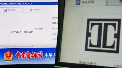 Computer screen shows the Ivanka Trump logo, right, and the website of the Chinese Trademark Office in Beijing, China, Monday, May 28, 2018. China has approved 13 Ivanka Trump trademarks in the last three months and granted provisional approval for eight more, raising fresh conflict-of-interest questions about the White House.