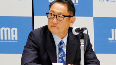 Toyota Motor Corp. chief Akio Toyoda speaks to reporters in Tokyo, Friday, May 18, 2018. Toyoda, tapped to head the Japanese auto industry association, promised Friday to lead a push among manufacturers to keep a competitive edge in emerging technologies such as zero-emission and autonomous driving.