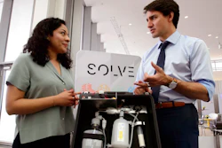 Prime Minister Justin Trudeau talks with Mariana Matus about her wastewater purification technology while visiting the MIT Media Lab and the Innovation Exhibition at Massachusetts Institute of Technology (MIT) in Boston on Friday, May 18, 2018.