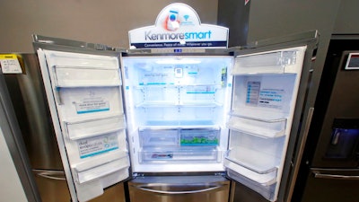 In this July 20, 2017, file photo, the Kenmore Elite Smart French Door Refrigerator appears on display at a Sears store in West Jordan, Utah. In a move announced Monday, May 14, Sears Holdings Corp. says a special committee of its board is starting a formal process to explore the sale of its Kenmore brand and related assets.