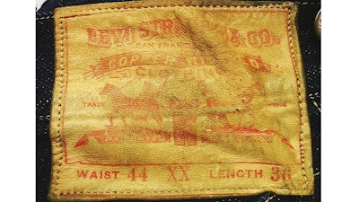 This undated photo provided by Daniel Buck Auctions, of Lisbon Falls, Maine, shows a label on a pair of 125-year-old Levi Strauss & Co., denim blue jeans that sold for nearly $100,000 this in May 2018 to a buyer in Asia. The jeans were purchased in 1893 by a store keeper in the Arizona Territory and were in pristine condition because they were worn only a few times.