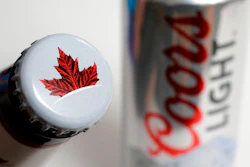In this Nov. 28, 2017, file photo products from the Mondelez International family of brands, Molson beer, left, and Coors Light beer rest together, in Walpole, Mass. The Molson Coors Brewing Company reports earnings Wednesday, May 2, 2018.