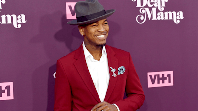 In this May 3, 2018, file photo, Ne-Yo arrives at the 3rd annual 'Dear Mama: A Love Letter to Moms' at The Theatre at Ace Hotel in Los Angeles. Kevin Foster, of Montclair, N.J., is accused of running a multimillion dollar scam that bilked singers Ne-Yo and Brian McKnight who invested in a sports drink company.