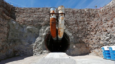 This April 9, 2015, file photo shows the south portal of the proposed Yucca Mountain nuclear waste dump near Mercury, Nev. The House is moving to approve an election-year bill to revive the mothballed nuclear waste dump at Nevada's Yucca Mountain despite opposition from home-state lawmakers.