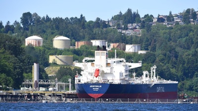 An oil tanker is moored at Kinder Morgan's Trans-Mountain marine terminal in Burnaby, British Columbia, Canada, Tuesday, May 29, 2018. Canadian Prime Minister Justin Trudeau's government announced plans Tuesday, May 29, 2018, to spend US$3.4 billion to purchase Kinder Morgan's Trans Mountain pipeline.