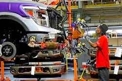 In this March 19, 2018, file photo, a line technician positions a truck front bumper for assembly at the Nissan Canton Assembly Plant, in Canton, Miss. On Wednesday, April 16, the Federal Reserve reports on U.S. industrial production for April.