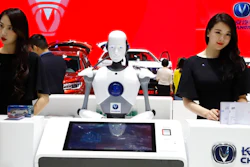 In this April 26, 2018, file photo, a robot assist receptionist is seen at the booth of a Chinese automaker during the China Auto 2018 show in Beijing, China. Under President Xi Jinping, a program known as 'Made in China 2025' aims to make China a tech superpower by advancing development of industries that in addition to semiconductors includes artificial intelligence, pharmaceuticals and electric vehicles.
