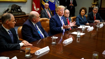 President Donald Trump speaks during a meeting with automotive executives in the Roosevelt Room of the White House, Friday, May 11, 2018, in Washington. From left, Environmental Protection Agency administrator Scott Pruitt, Ford CEO James Hackett, Trump, White House chief economic adviser Larry Kudlow, Secretary of Transportation Elaine Chao, and Nissan Motor Company senior vice president Scott Becker.