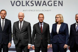 Herbert Diess, center , CEO of the Volkswagen stock company, and the members of the Board of Management of Volkswagen, Hiltrud Dorothea Werner, 2nd right, and Frank Witter, 2nd left, Oliver Blume, left, CEO of Porsche AG, and Rupert Stadler, right, CEO of Audi AG, pose for the media prior to the shareholder's meeting in Berlin, Germany, Thursday, May 3, 2018.