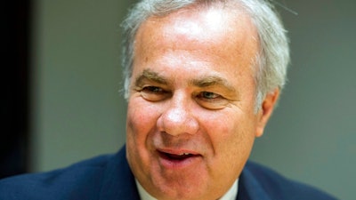 In this June 14, 2016, file photo, Valeant Pharmaceuticals chairman and CEO Joe Papa speaks to reporters after the company's annual meeting in Laval, Quebec. Valeant Pharmaceuticals now wants to be called Bausch Health Companies, as the Canadian drugmaker continues to distance itself from notoriety gained a few years ago by dramatically hiking the prices of treatments it acquired. Papa said in a statement that the new identity was “a major step forward” in his company’s transformation.