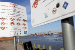 In this March 1, 2018 photo, signs warn people not to fish or crab at River Terrace Park in Channelview, Texas, one of four county parks adjacent to hotspots in the San Jacinto River Waste Pits.