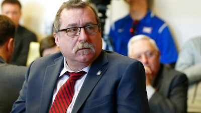 In this Feb. 8, 2018, file photo, Oklahoma state Rep. Mark McBride, listens during a committee hearing in Oklahoma City. The president of a Texas-based wind energy trade group has been subpoenaed to appear before an Oklahoma grand jury looking into McBride's claim that someone connected to the industry is responsible for putting a tracking device on his pickup. The Republican has worked on worked on legislation to tax wind-energy companies.