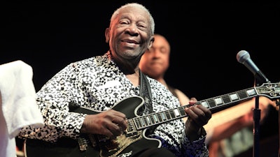 In this Aug. 8, 2013, file photo, Blues music legend B.B. King performs on Frampton's Guitar Circus 2013 Tour at Pier Six Pavilion, in Baltimore. The maker of the Gibson guitar, omnipresent for decades on the American music stage, is filing for bankruptcy protection after wrestling for years with debt. A pre-negotiated reorganization plan filed Tuesday, May 1, 2018, will allow Gibson Brands Inc. to continue operations with $135 million in financing from lenders.