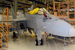In this Wednesday, April 25, 2018, photo, the first F/A-18 Super Hornet, of many to come, undergoes updates and maintenance at Boeing's facility in St. Louis. This fighter aircraft was delivered by Boeing to the U.S. Navy in November 2004 and is at the end of its lifespan. After being refurbished, it can be piloted for an additional 3,000 flight hours, or 10-15 years.