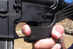 In this Oct. 4, 2017, file photo, shooting instructor Frankie McRae demonstrates the grip on an AR-15 rifle fitted with a 'bump stock' at his 37 PSR Gun Club in Bunnlevel, N.C.