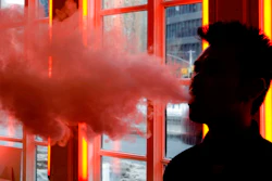 In this Feb. 20, 2014 file photo, a customer exhales vapor from an e-cigarette at a store in New York. In a large study of company wellness programs released on Wednesday, May 23, 2018, e-cigarettes worked no better than traditional stop-smoking tools, and the only thing that really helped was paying folks to kick the habit.